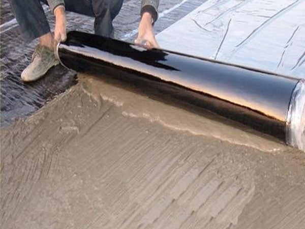 Self adhesive wet laid waterproofing membrane